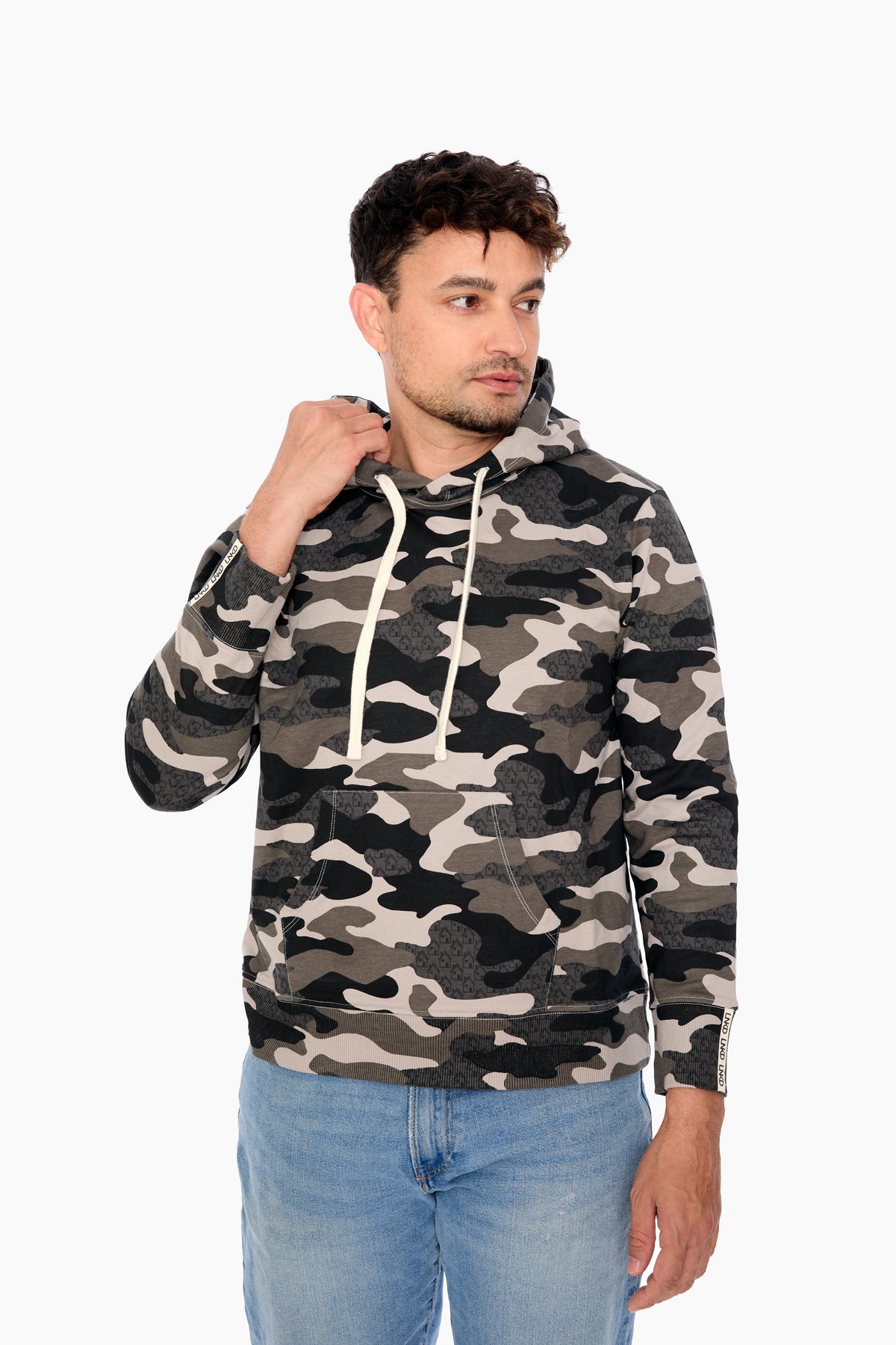 A male model wearing a gray camouflage print hoodie with a hood and drawstrings.