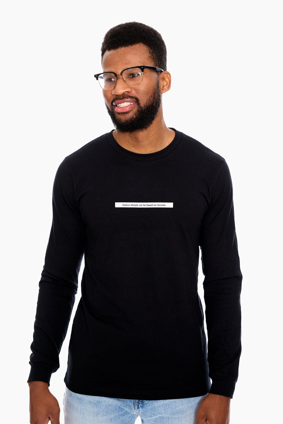 A man wearing a black long-sleeved T-shirt with the word 'TRUTH' printed across the chest in white letters.