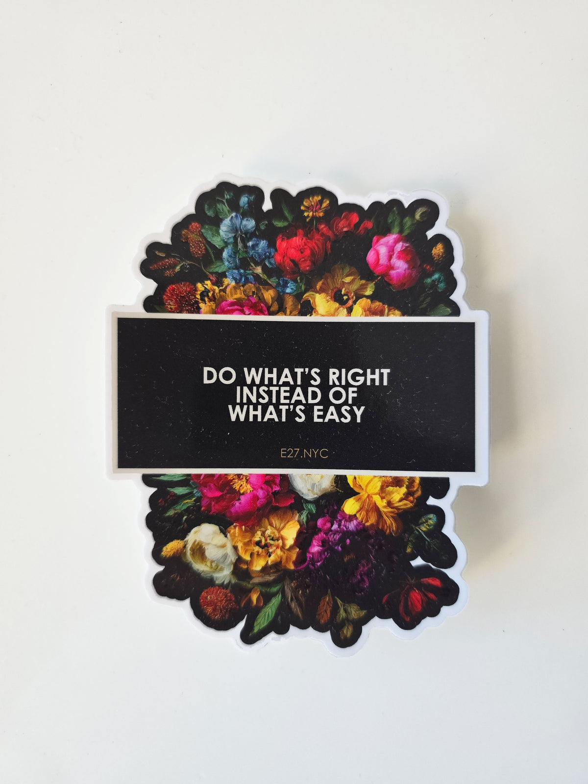 Sticker with floral design andDO WHat's Right Instead of What's Easy tect on a white background
