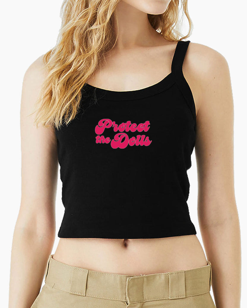 Black Eleven27 tank top with pink "Protect The Dolls" worn by a person on a white background