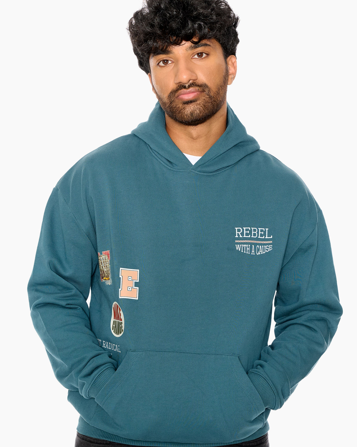 Man wearing a teal hoodie with patches and text on a white background
Eleven27 French Terry hooded sweatshirt with patch-style graphics on the front.