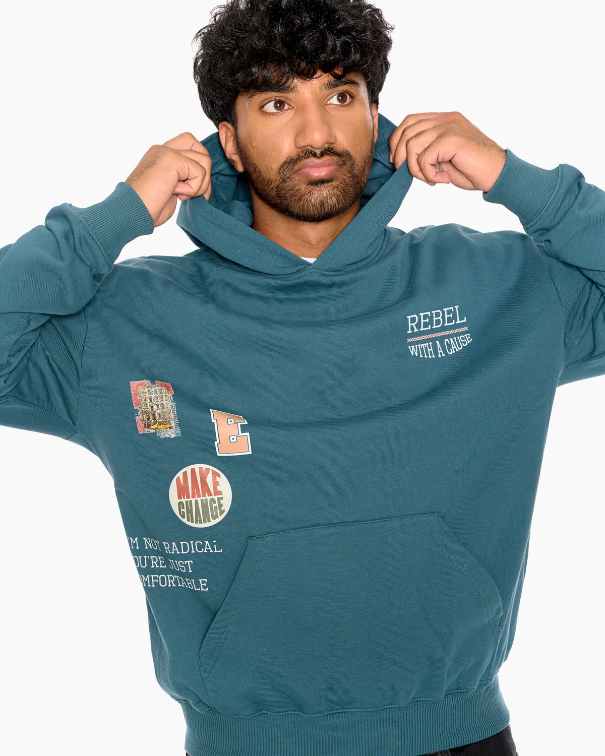Man wearing a teal hoodie with text and graphics on a white background
Eleven27 French Terry hooded sweatshirt with patch-style graphics on the front.