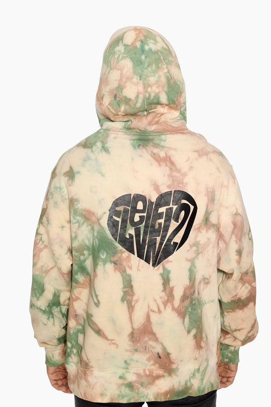 Tie-dye hoodie with an Eleven27 heart logo on the back against a white background