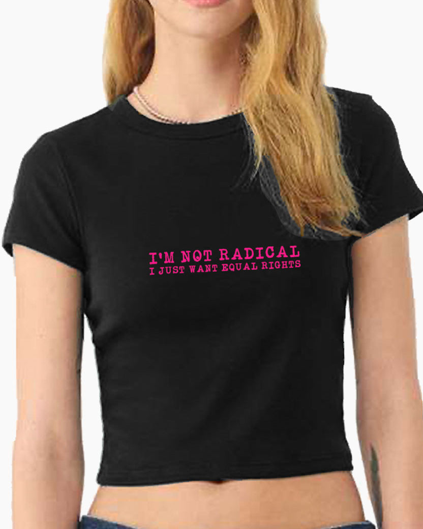 Person wearing a black Eleven27 baby tee with pink 'I'm not radical I just want equal rights' graphic on a white background