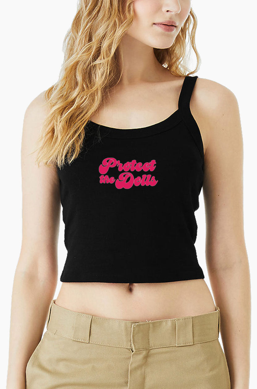 Black Eleven27 tank top with pink "Protect The Dolls" worn by a person on a white background