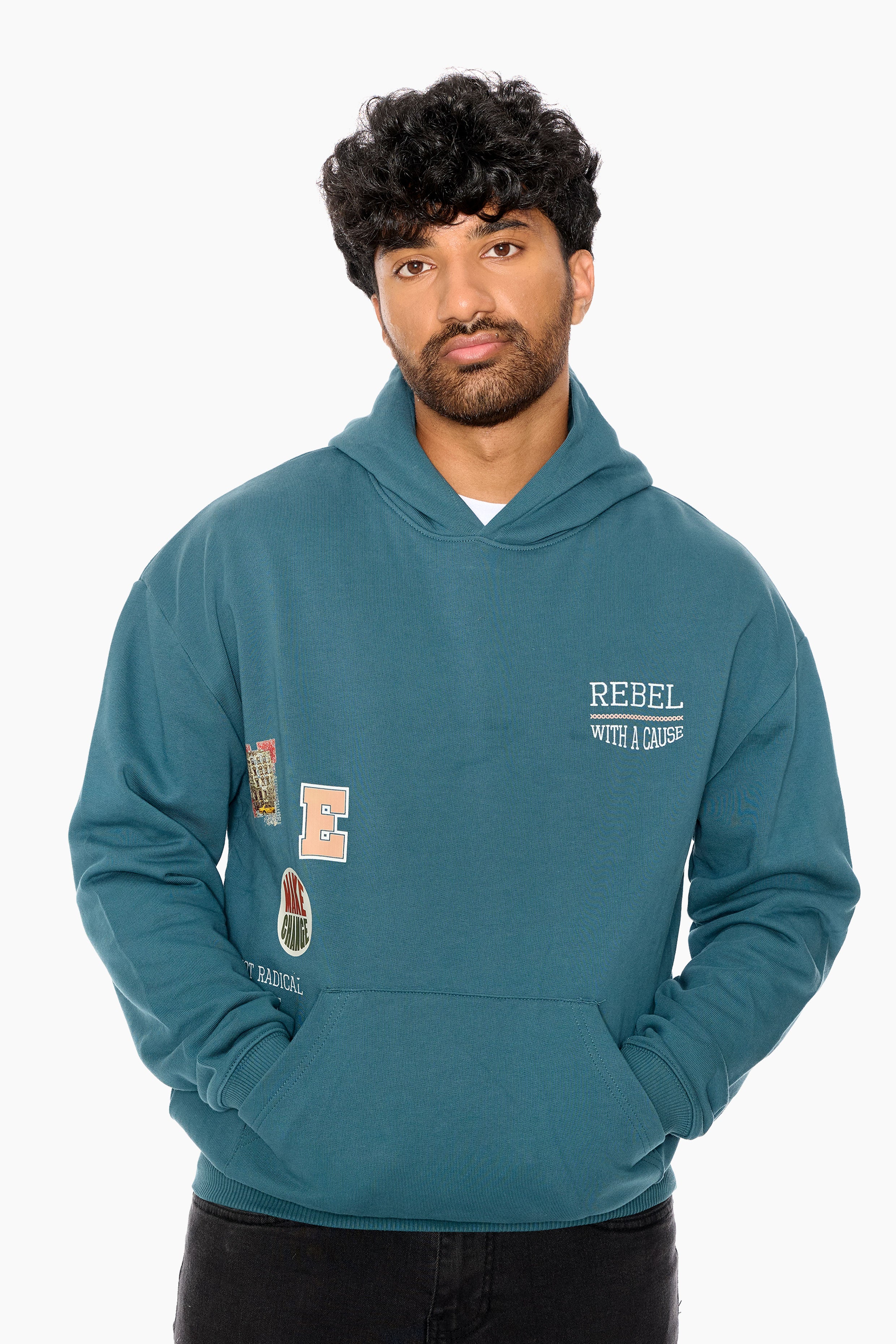 Man wearing a teal hoodie with patches and text on a white background
Eleven27 French Terry hooded sweatshirt with patch-style graphics on the front.
