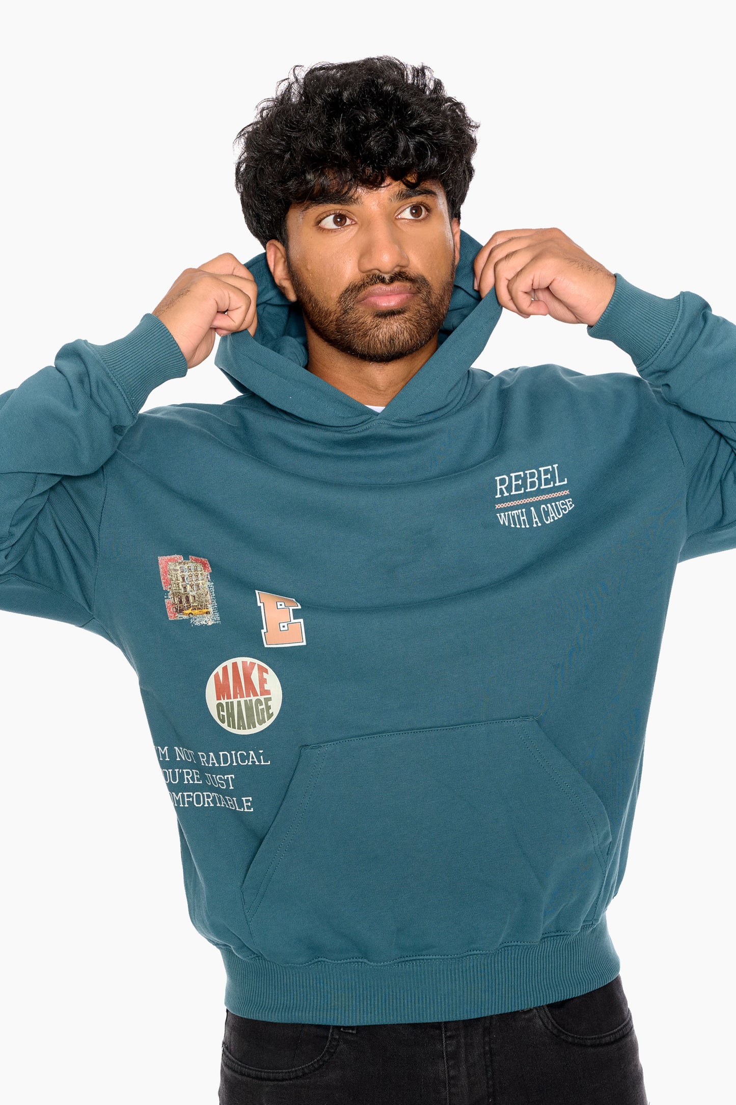 Man wearing a teal hoodie with text and graphics on a white background
Eleven27 French Terry hooded sweatshirt with patch-style graphics on the front.