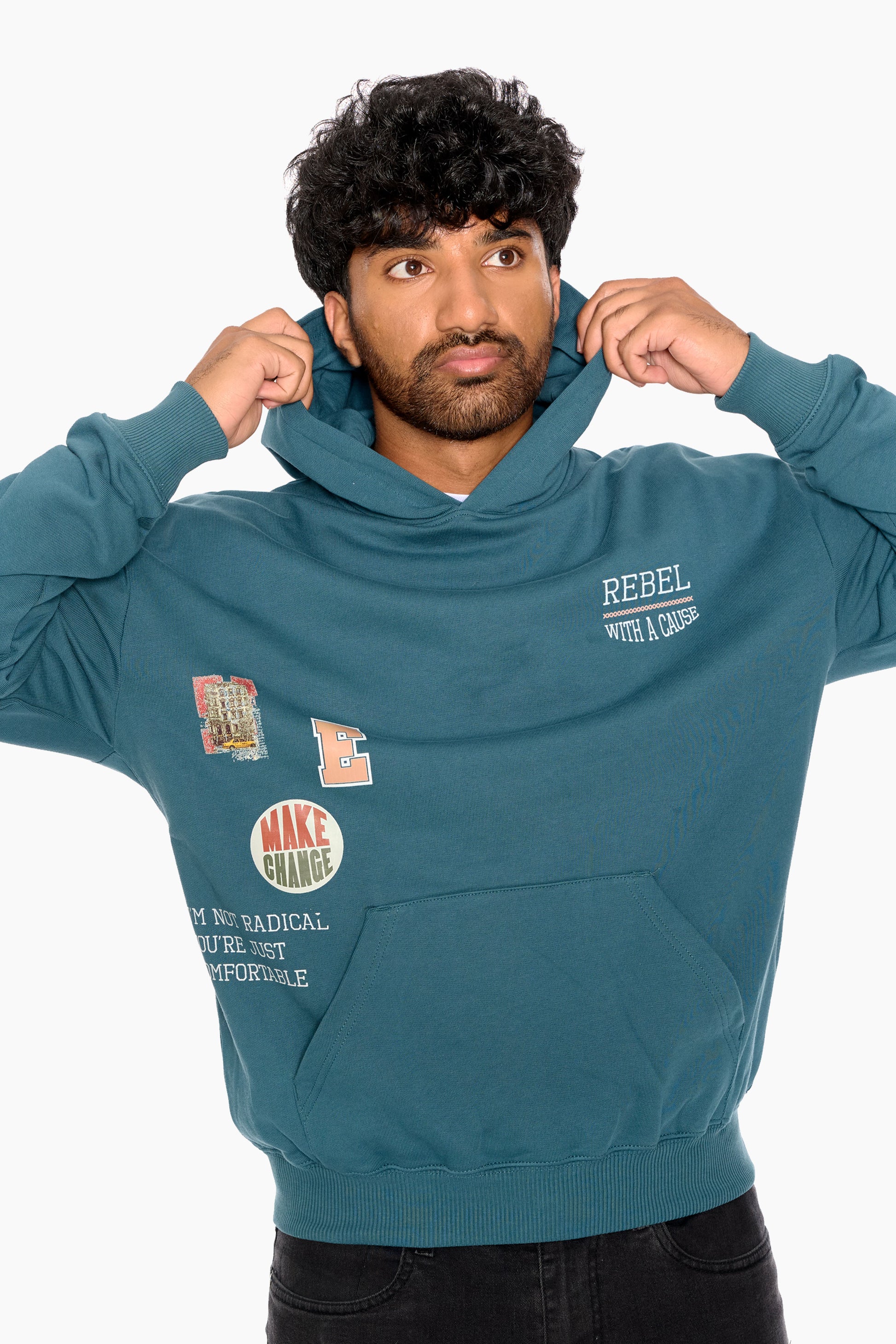 Man wearing a teal hoodie with text and graphics on a white background
Eleven27 French Terry hooded sweatshirt with patch-style graphics on the front.