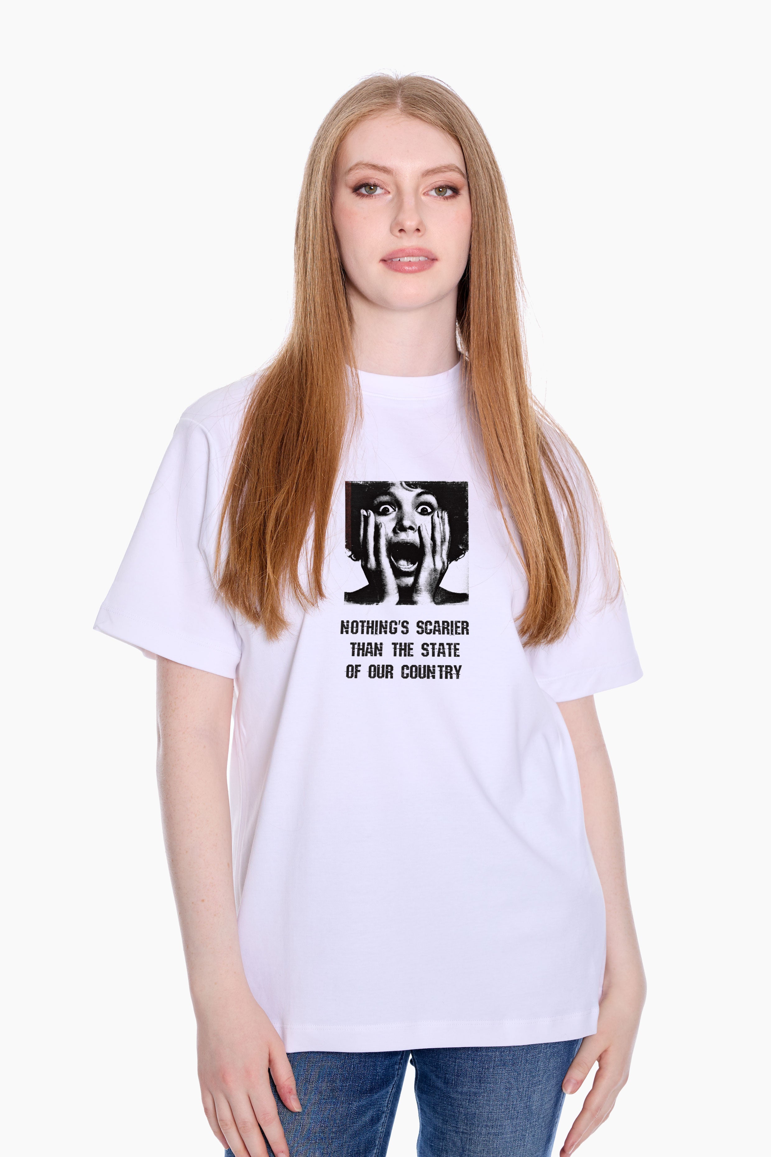 Person wearing a white Eleven27 t-shirt with graphic design and "Nothing's Scarier Than The State of Our Country" on a white background