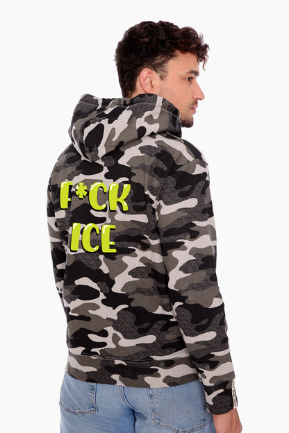 Male wearing a camo hoodie with F*CK ICE graphic on the back
