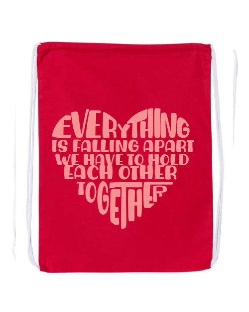 Red drawstring bag with coral text graphic on a white background