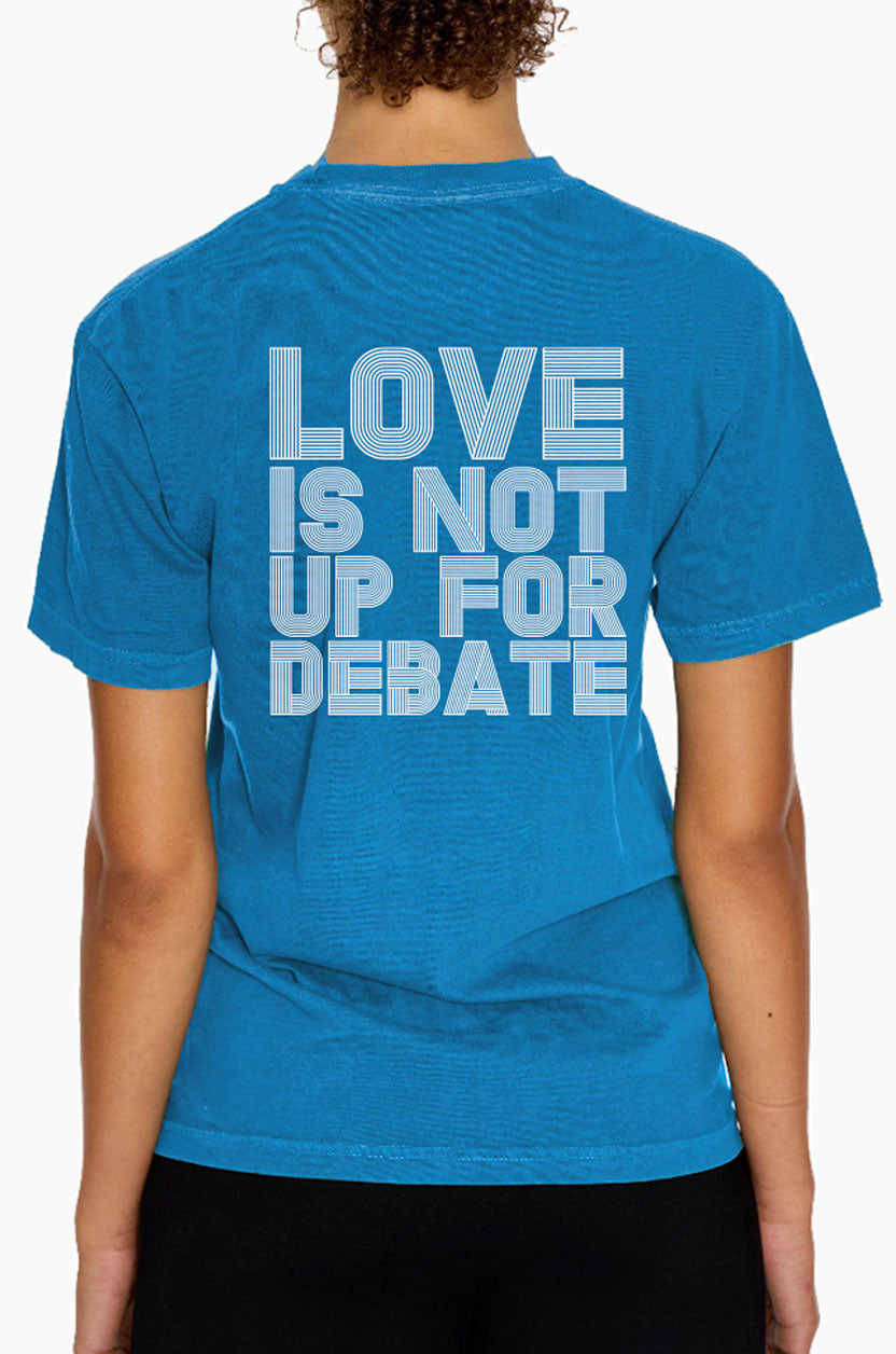 Person wearing a Eleven27 blue t-shirt with 'LOVE IS NOT UP FOR DEBATE' text on the back.