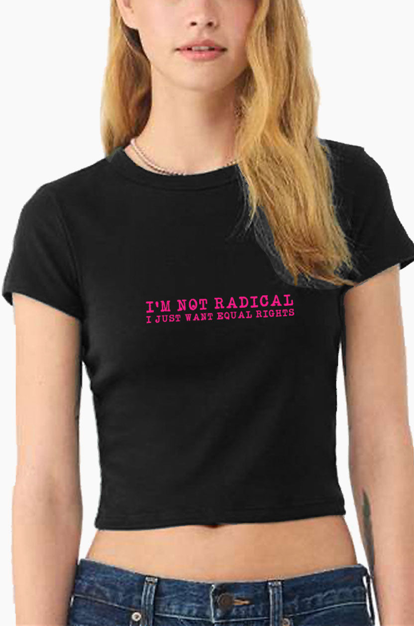 Person wearing a black Eleven27 baby tee with pink 'I'm not radical I just want equal rights' graphic on a white background