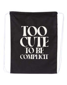 Black drawstring bag with white text 'Too Cute to be Complicit' on a white background